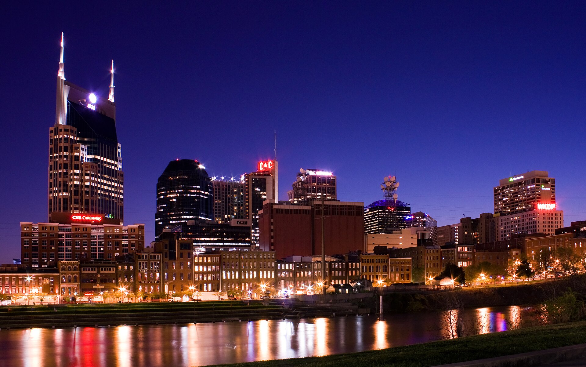 Downtown Nashville skyline at night, reflected in the Cumberland River