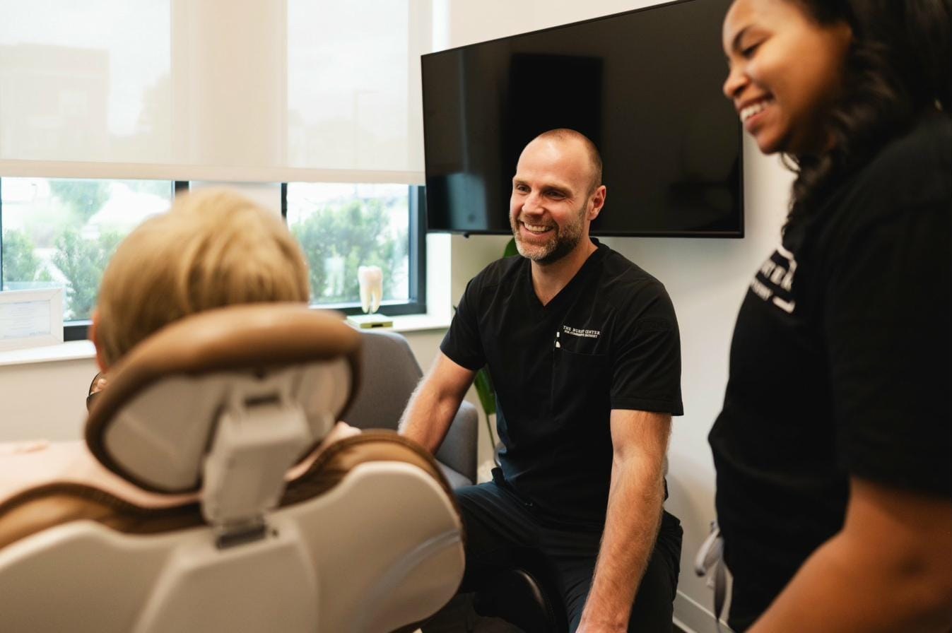 Dr. Will and a hygienist with a patient