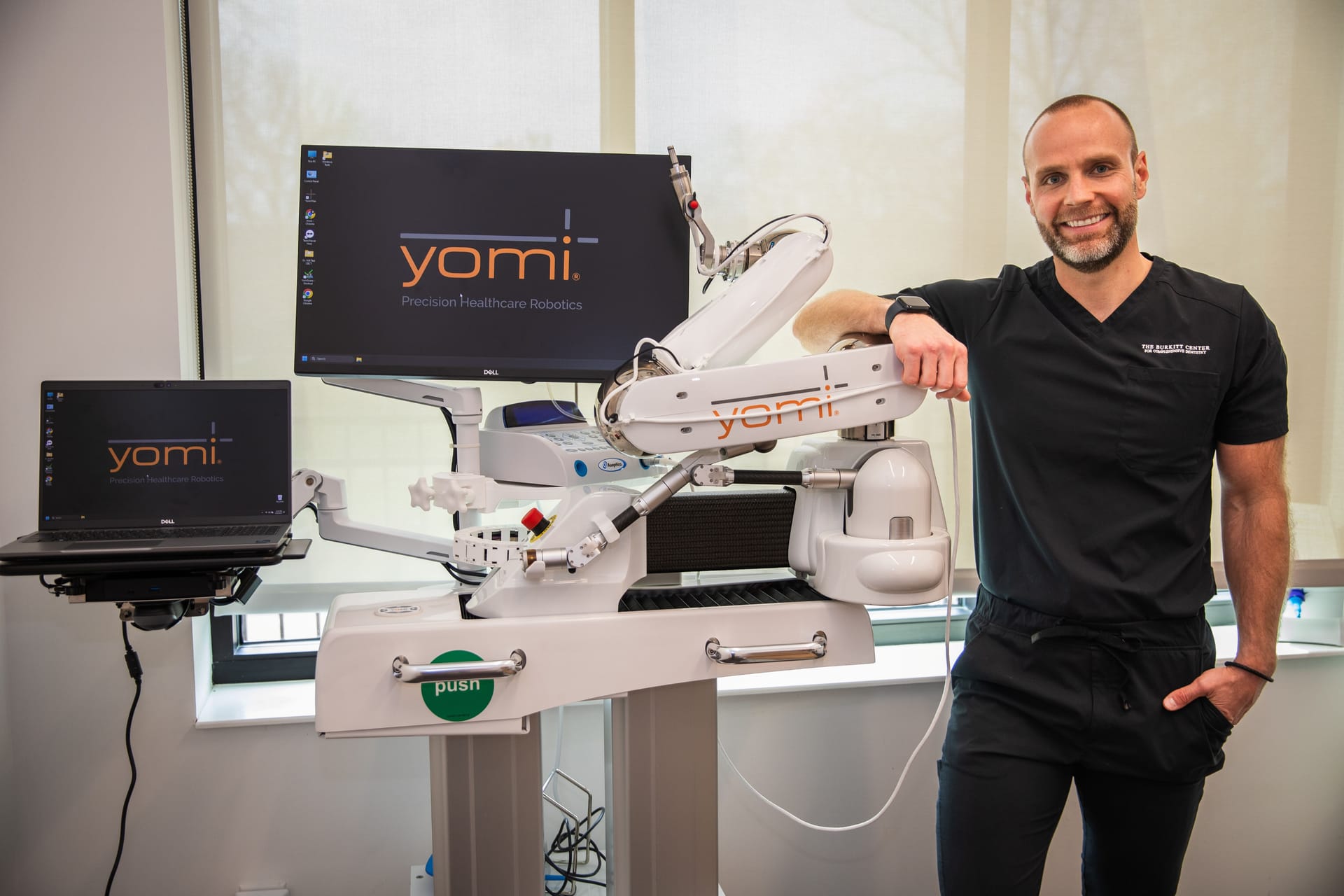Dr. Will with the Yomi robotic implant surgery system at The Burkitt Center